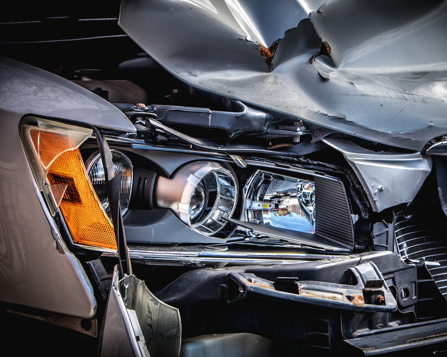 Headline area on a grey car after a car accident - Spitzer Legal Automotive Accident Practice Area